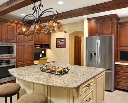 An old world, Mediterranean-inspired kitchen in Palo Alto features an ornate light fixture.