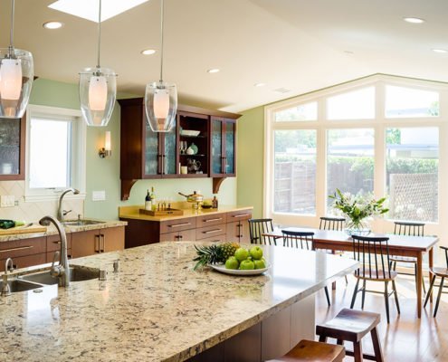 A light-filled transitional kitchen in Los Altos offers space to cook and eat.