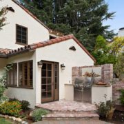 Small patio with grill at Spanish-style house