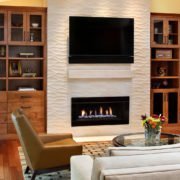 A textured fireplace offers an organic feel in this Palo Alto living room.