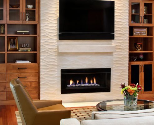 A textured fireplace offers an organic feel in this Palo Alto living room.