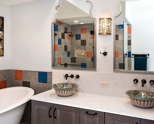 A Moroccan-inspired bathroom in Palo Alto features unique sinks and tile work.