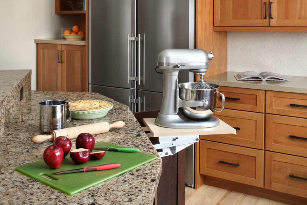 A built-in appliance lift brings a stand mixer to counter height.