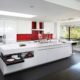 An über-modern Los Altos Hills kitchen is sleek, with a bold pop of color on the backsplash.