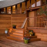 Redwood decking and intricate redwood railing in the front of a home in Redwood City.