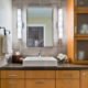 A contemporary bathroom with a vessel sink and plenty of storage.