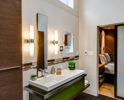 A modern bathroom in downtown Palo Alto adds a pop of color in its floating vanity.