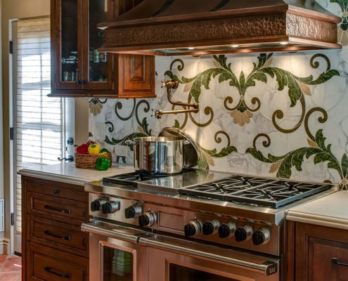 An ornate backsplash adds warmth to this Mediterranean-inspired kitchen in Palo Alto.