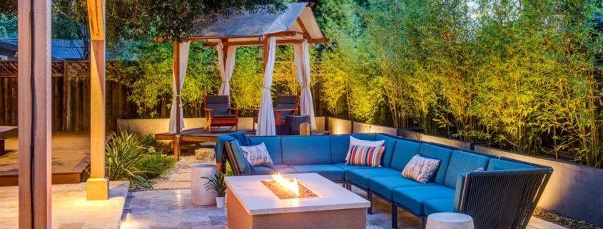 An outdoor Design + Build project featuring a fire pit and trellis.