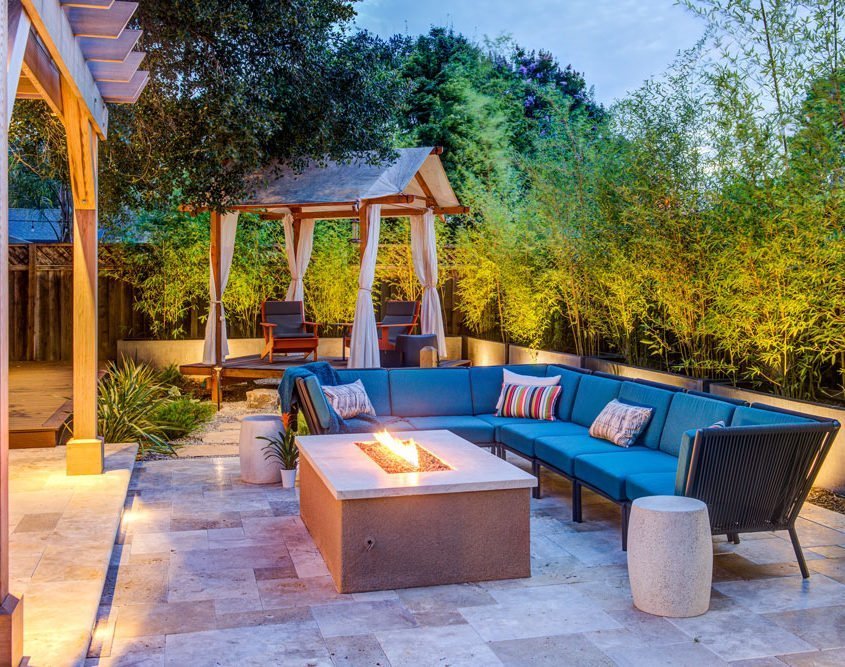 An outdoor Design + Build project featuring a fire pit and trellis.