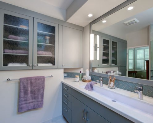 A serene bathroom in Palo Alto with a unique dual vanity.