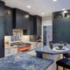 A Palo Alto kitchen using complementary colors, with blue cabinetry and a bright orange stove.