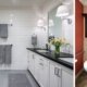 Two images of Universal Design bathrooms side-by-side. One is modern and grey, while the other is traditional and colorful.