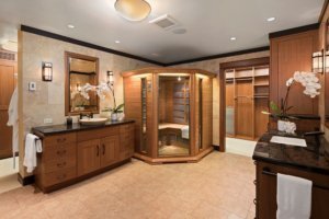 A large universal design bathroom has ample space for a sauna and walk-in closet.