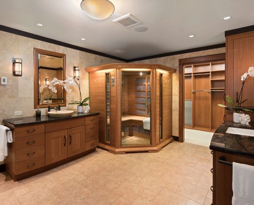 A large universal design bathroom has ample space for a sauna and walk-in closet.