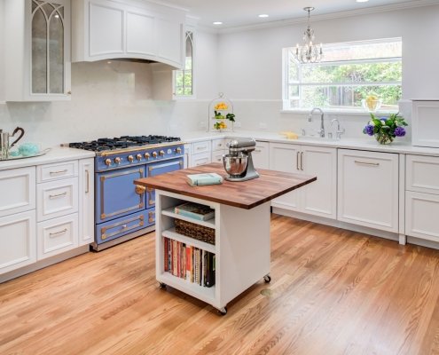 A Menlo Park kitchen adds a pop of color with a beautiful blue stove.