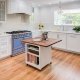 A Menlo Park kitchen adds a pop of color with a beautiful blue stove.