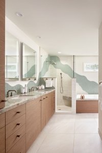 A primary bathroom in Palo Alto features artful decorative tile and luxurious appliances.