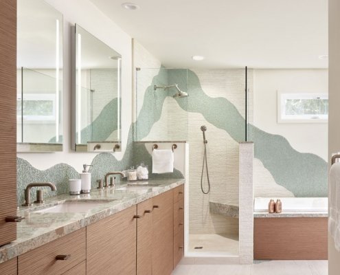 A primary bathroom in Palo Alto features artful decorative tile and luxurious appliances.