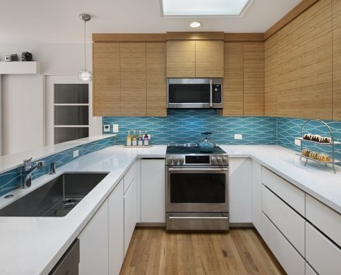 A modern Mountain View kitchen features a pop of color with its geometric tiled backsplash.