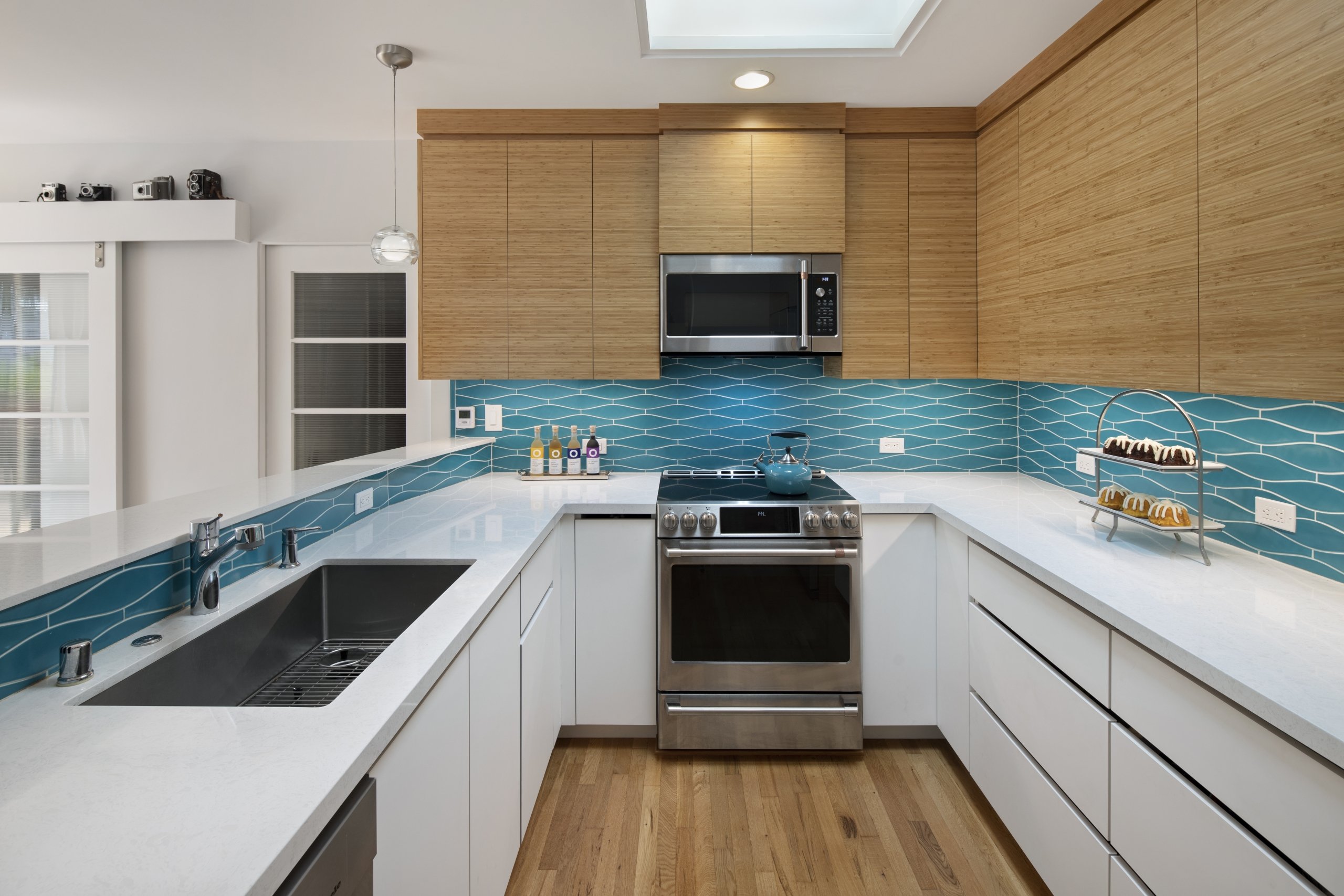A modern Mountain View kitchen features a pop of color with its geometric tiled backsplash.