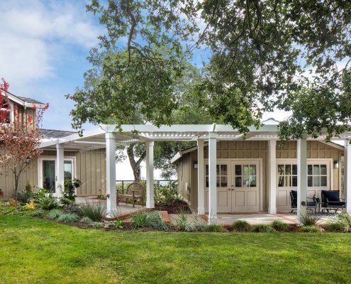 A new louvered pergola offers partial to full coverage in Los Altos Hills.