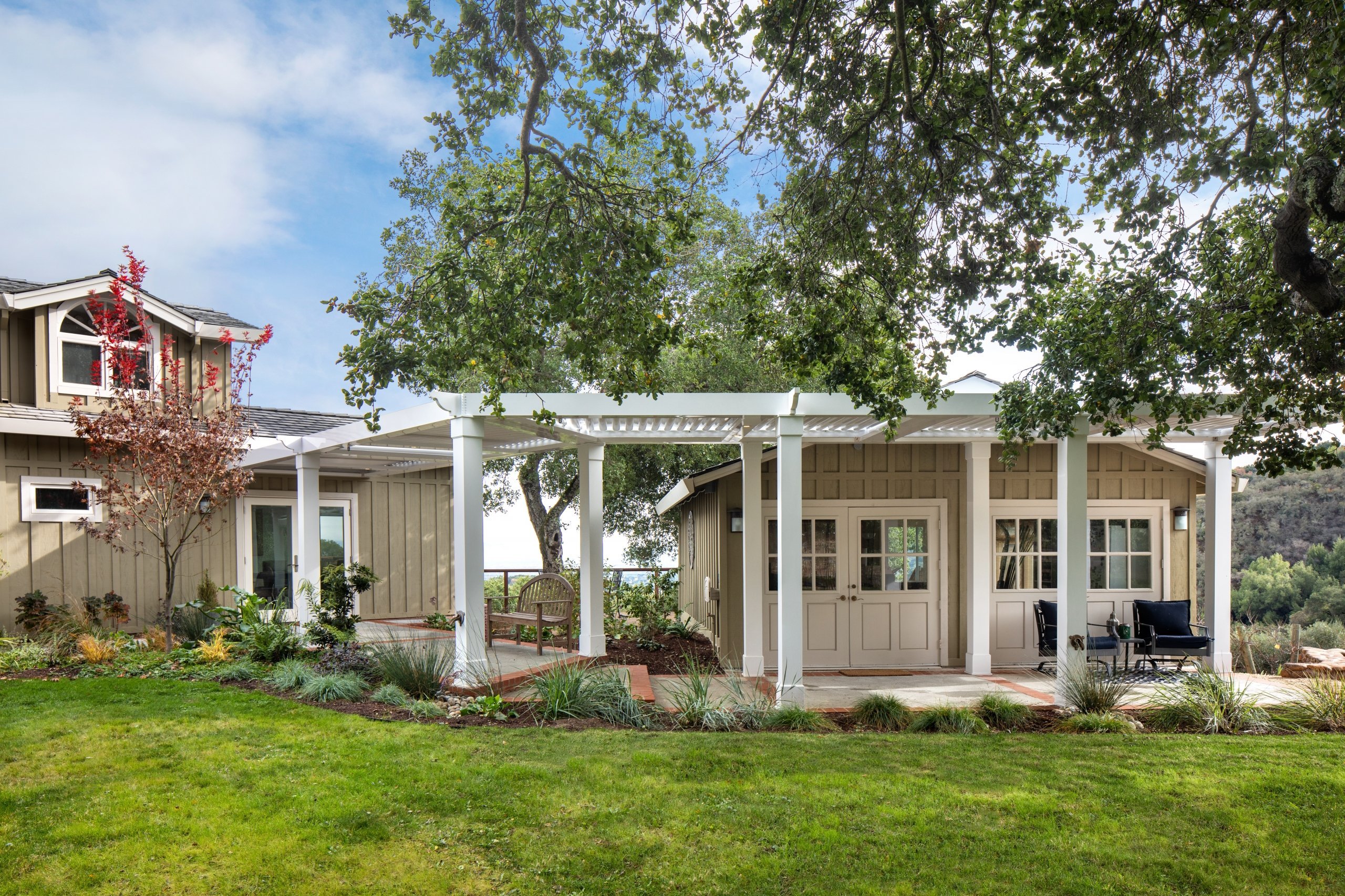 A new louvered pergola offers partial to full coverage in Los Altos Hills.