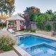 gazebo outdoor seating and pool daytime