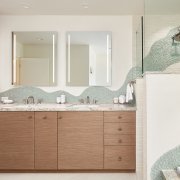 Bathroom with green wave backsplash