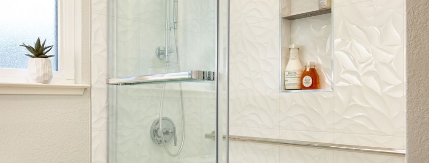 white bathroom and shower with shower shelves