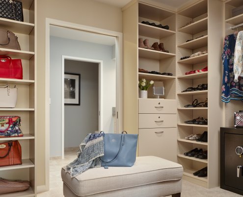 A walk-in closet gives this Los Gatos homeowner a chance to display her wardrobe and handbags.