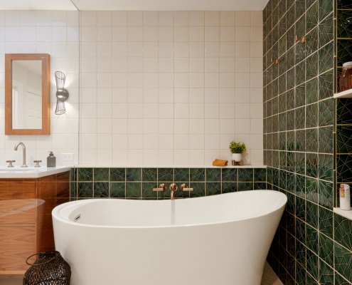 A sleek, modern tub is located in a glass enclosed shower in San Jose.