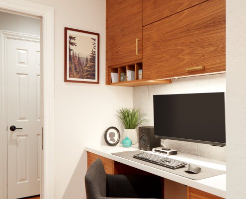 A San Jose home has an office nook featuring custom wooden cabinetry.