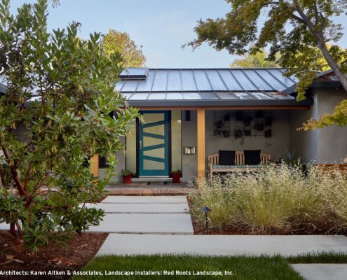 A modern home in San Jose adds a touch of playfulness with a colorful, geometric front door.